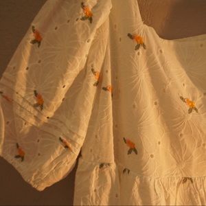 Lovely white mini dress, classic aesthetic. Light and airy, cinched sleeves.